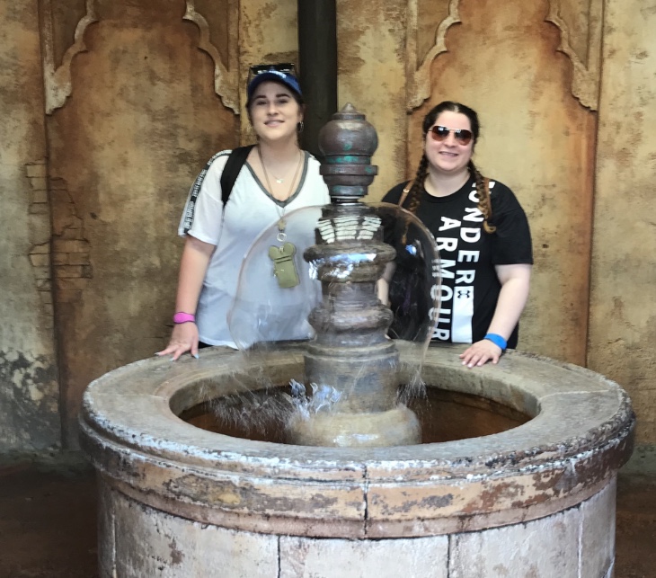 DVC Members on Vacation | Girls Standing by Disney Fountain