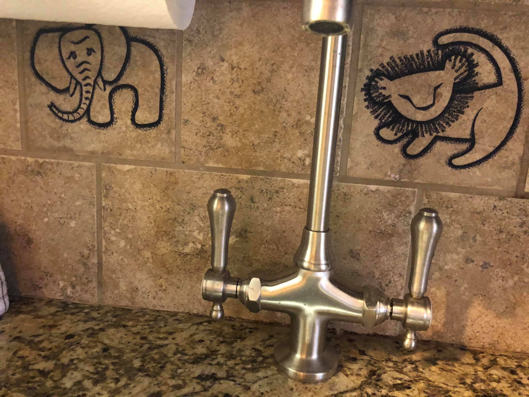 Jambo Deluxe Studio | Sink With Elephant and Lion Printed Tiles