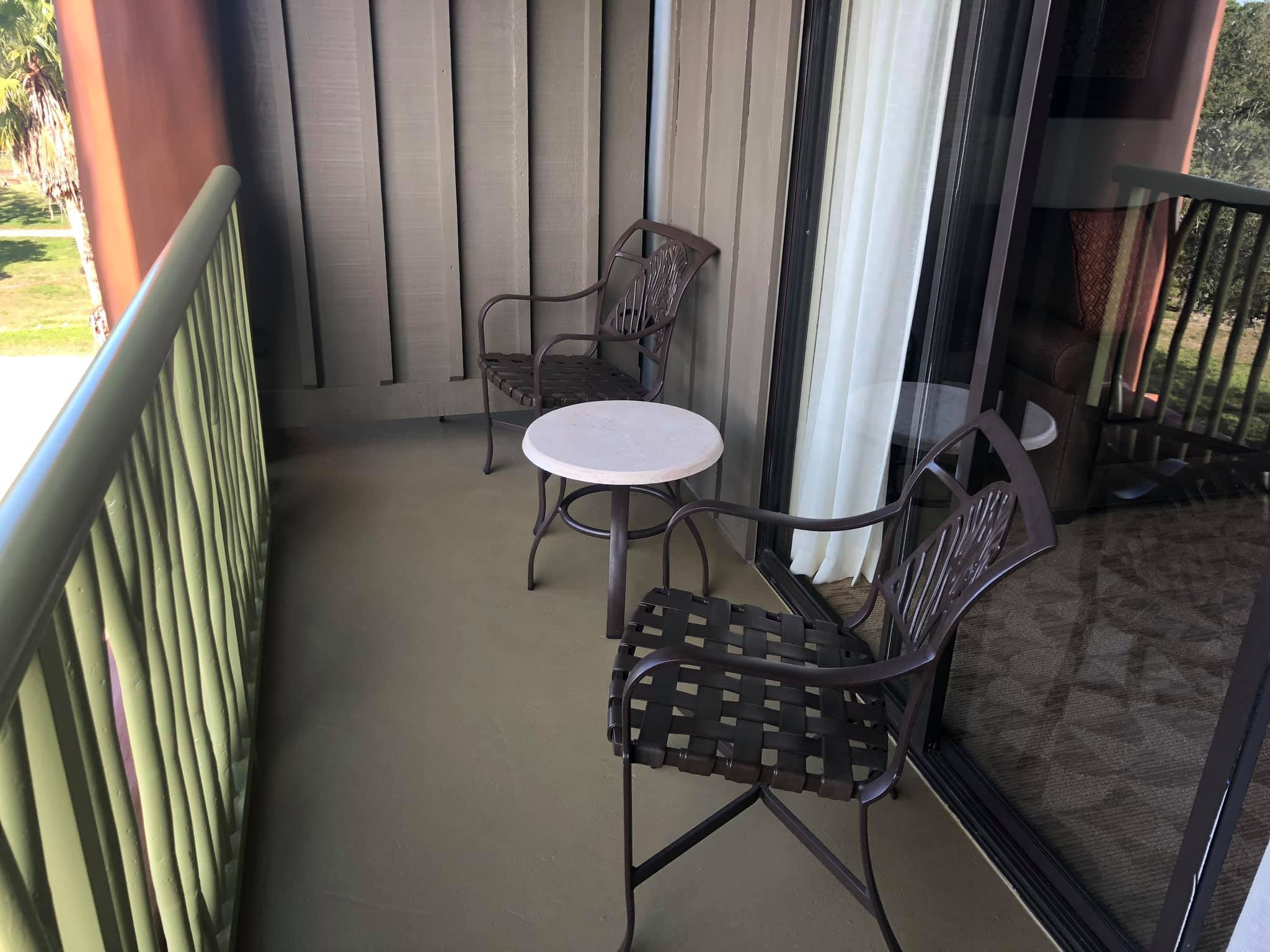 Animal Kingdom Studio | Balcony With 2 Chair and Small White Coffee Table