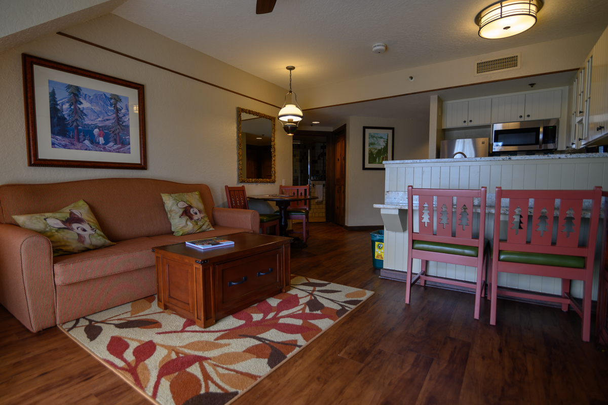 Boulder Ridge Villas | Living Room With Paintings on The Wall A Sofa and A Center Table