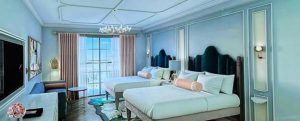 A bedroom with two beds Description automatically generated with medium confidence